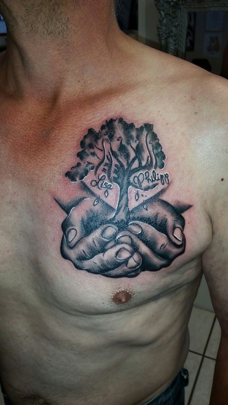 a man's chest with two hands holding a tree and the words caring on it