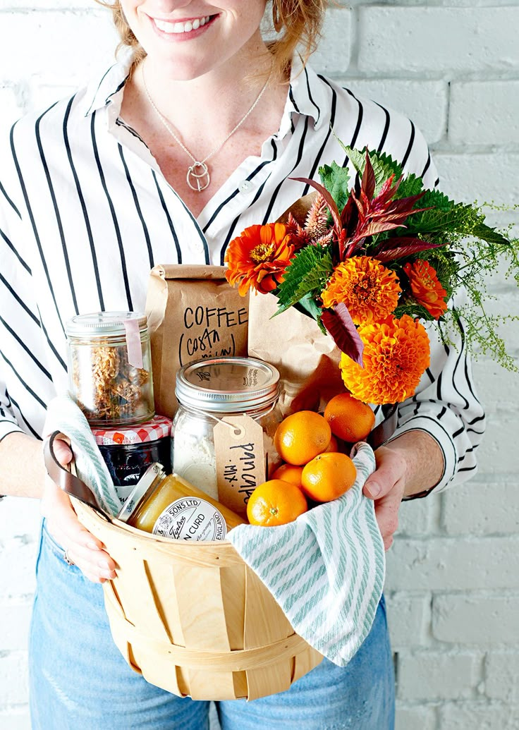 a woman holding a basket full of food