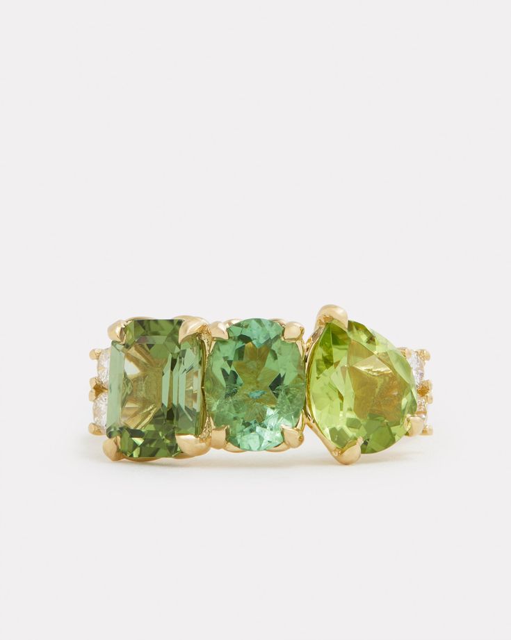 18K Yellow Gold Cluster Ring with Green Tourmaline, Peridot, and Diamonds, .2 TCWOrnament is 7/8 Inch x 3/8 Inch Style# YRCOCPGW Emerald And Peridot Engagement Ring, 14k Gold Green Gemstones, Timeless Green Rings With Accent Stones, Green Multi-stone Gemstones In Fine Jewelry Style, Green Multi-stone Gemstones Fine Jewelry, Green Multi-stone Fine Jewelry Gemstones, Green Tourmaline Multi-stone Emerald Ring, Green Multi-stone Gemstones In 14k Gold, Green Three Stone Peridot Jewelry