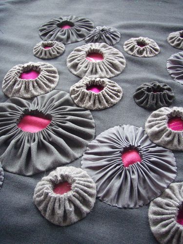 several different types of ruffles laid out on a tablecloth with pink center