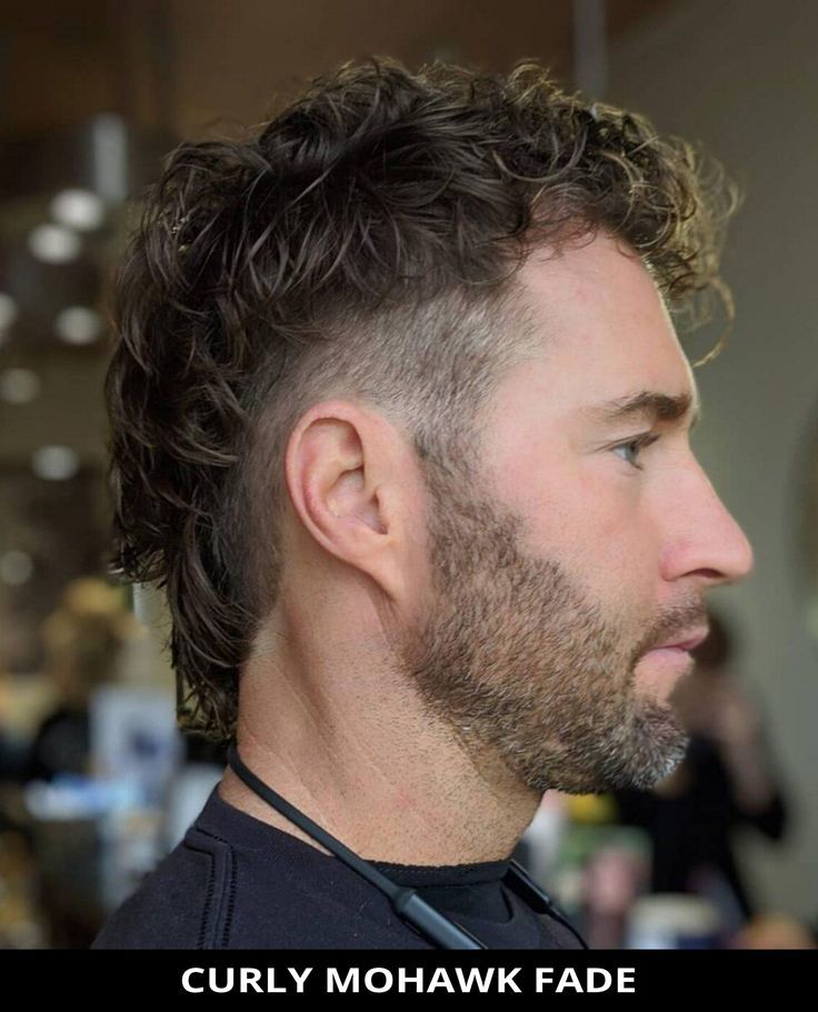 Style your hair into this modern curly mohawk fade for your next cut! Click here to see all of the 22 Popular Mohawk Fade Haircuts for a Flattering Look. // Photo Credit: @elevatedundercuts on Instagram Fohawk Haircut Fade, Long Hair Mohawk, Fohawk Haircut, Mohawk Fade, Curly Mohawk Hairstyles, Curly Faux Hawk, Mohawk For Men, Mohawk Haircut, Mohawk Hairstyles Men