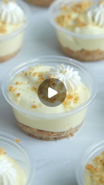 several small desserts in plastic containers on a table