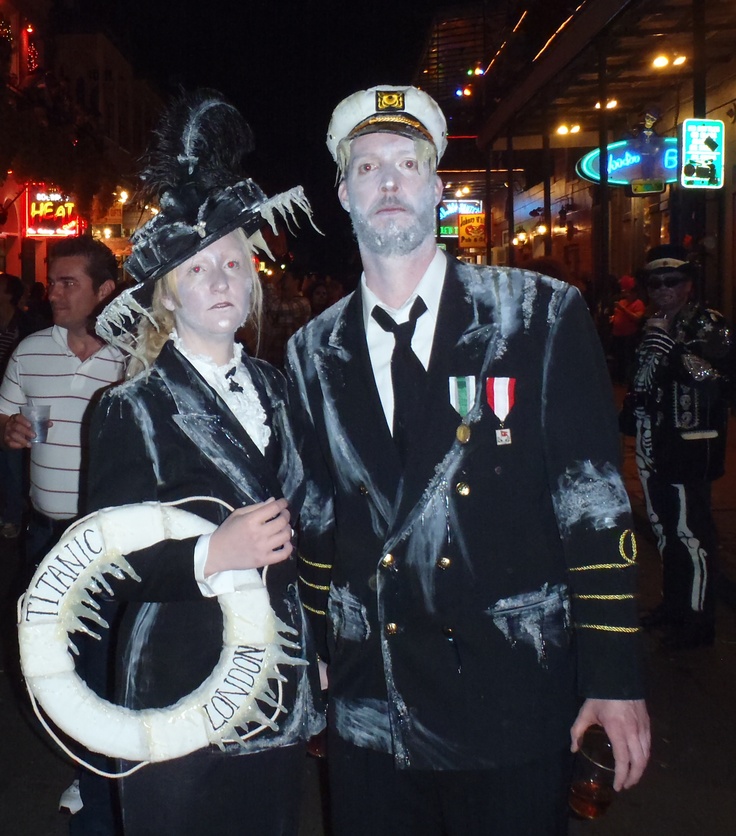 a man and woman dressed in costumes standing next to each other