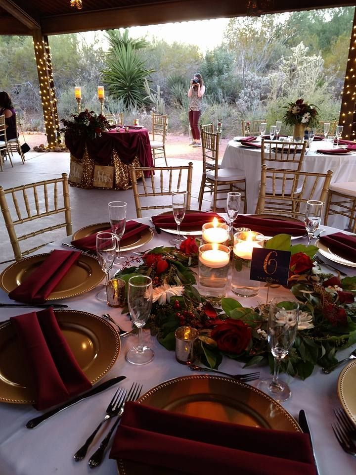 the table is set with candles and place settings