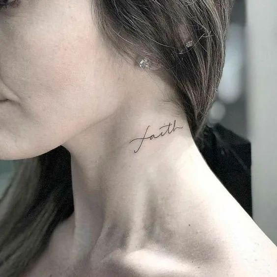 a woman's neck with the word faith tattooed on her left side ribcage