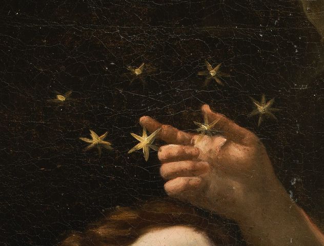 a close up of a person's hand with stars in the background