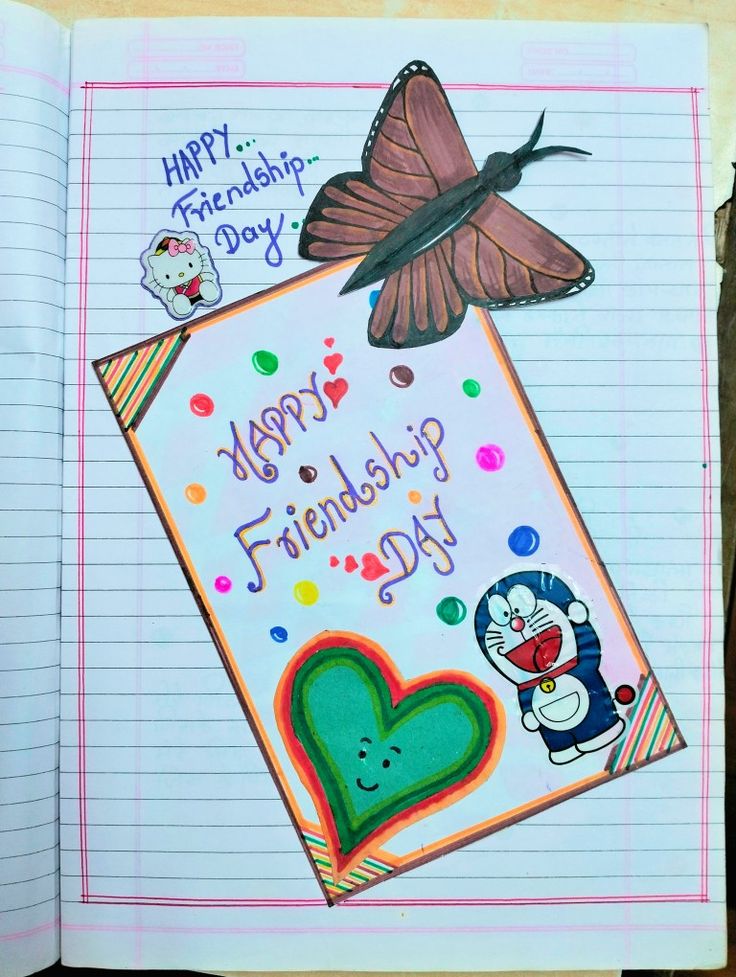 an open notebook with a drawing of a butterfly on top of it and the words happy friendship