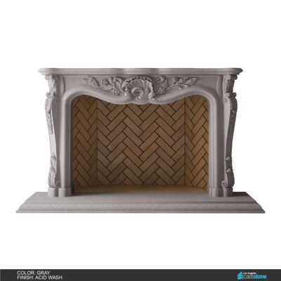 a white fireplace with a wooden mantle and carvings on the top, in front of a white background