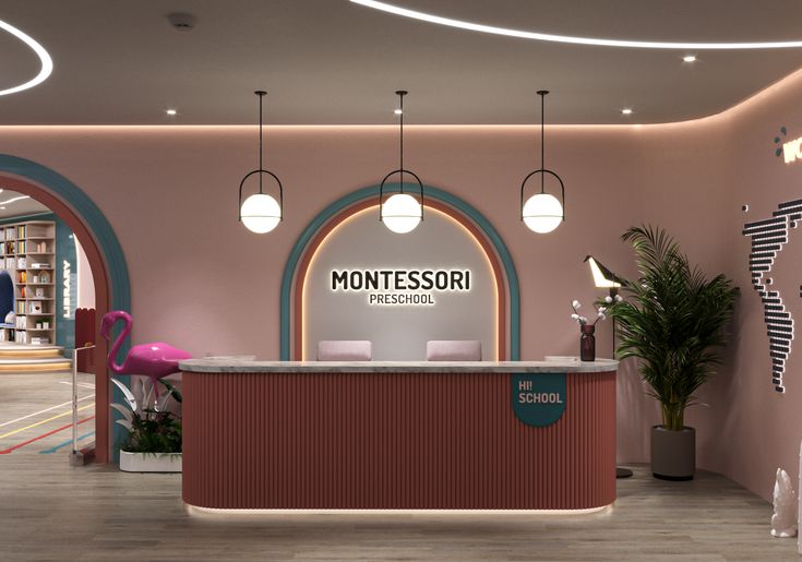 the front desk of montessori's children's book store with pink walls and arches