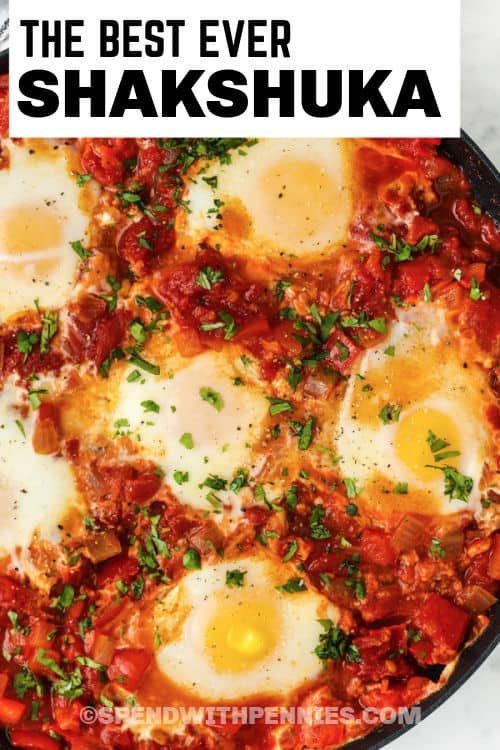 the best ever shakshuka recipe in a skillet with eggs on top