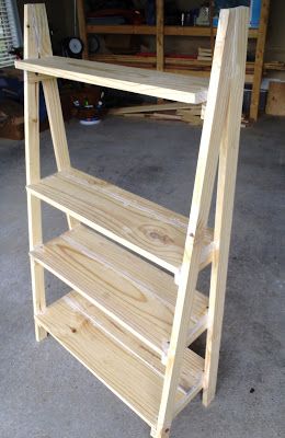 a wooden shelf sitting on top of a floor