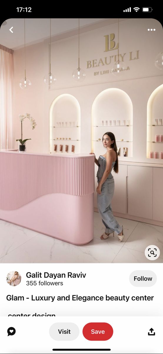 a woman standing behind a pink counter in a beauty salon with the caption glam luxury and elegance beauty center