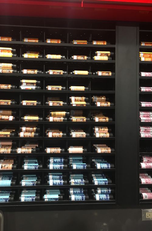 a display case filled with lots of different types of food in front of a red light