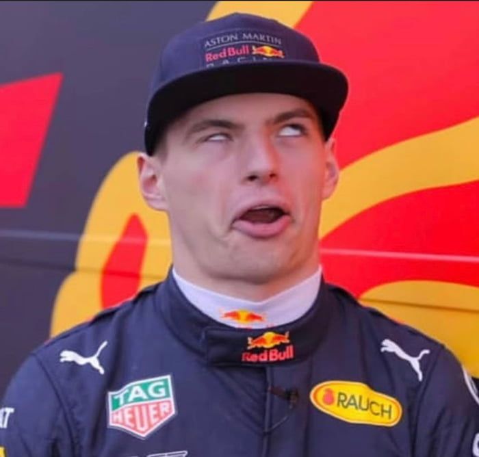 a man in a red bull uniform making a surprised face