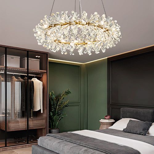 a bedroom with a bed, closet and chandelier hanging from it's ceiling