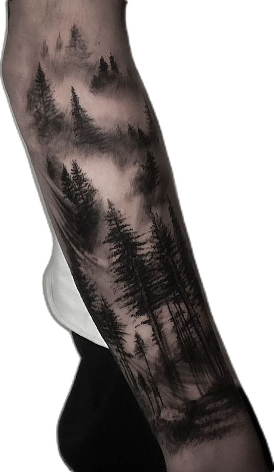 a man's arm with trees and clouds on it