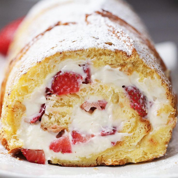 a close up of a pastry with strawberries on it