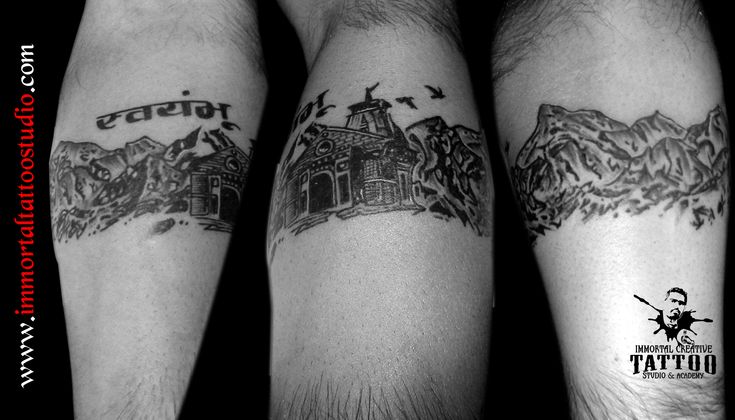 two men with tattoos on their arms, one has a castle and the other has mountains