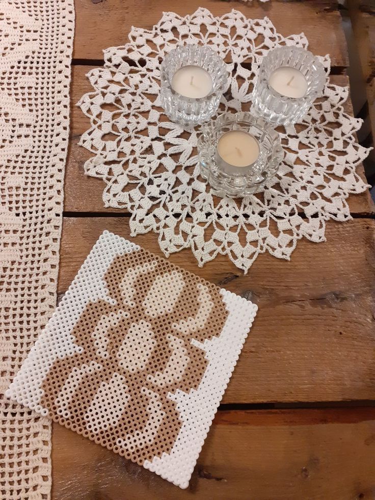 doily and candles on a wooden table