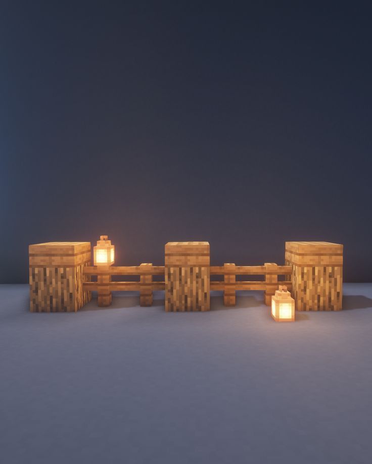 a group of wooden benches sitting next to each other on top of snow covered ground