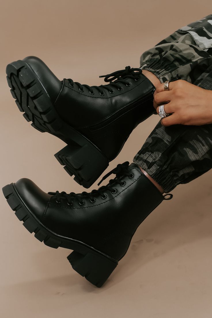 Step into urban chic with our High Street Combat Boot in Black. These boots seamlessly blend style and functionality, adding an edgy flair to your look while providing the comfort and durability needed for any adventure. Combat boot Lace up Platform boot Black Zipper up the side Need help with sizing? No problem! Join our VIP group on Facebook, Everyday Chic Boutique VIP Insiders to chat directly with our team and other customers just like you.Packaged with love and shipped from our warehouse in Wilmington, Ohio Women Black Combat Boots, Vlack Boots, Black Cargo Boots, Army Boots Women, Cool Boots Aesthetic, Combat Boot Style, Army Boots Drawing, Black Combat Work Boots, Black Clothes Aesthetic