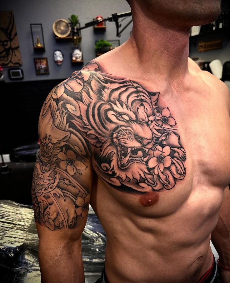 a man with a tattoo on his chest