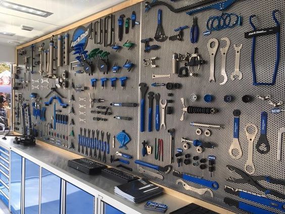 there is a large display of tools on the wall