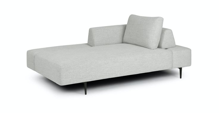 a white couch with two pillows on it