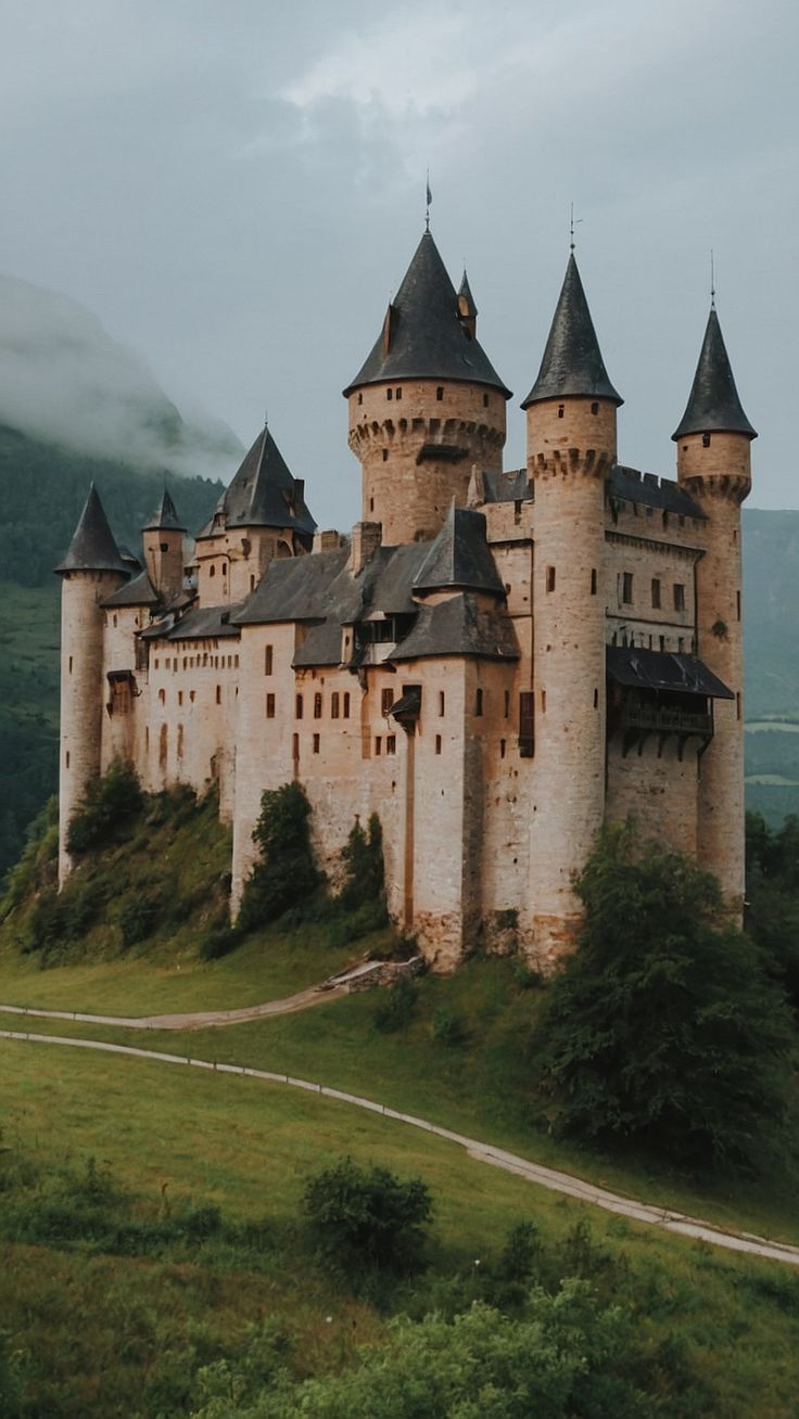 an old castle sits on top of a hill