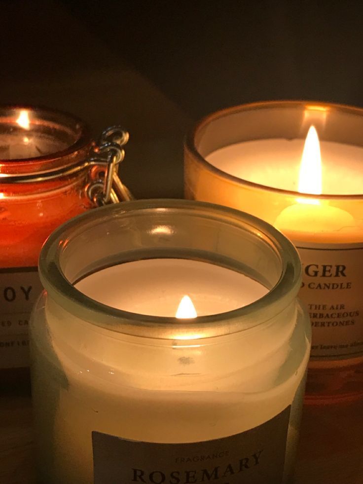 three candles sitting next to each other on a table