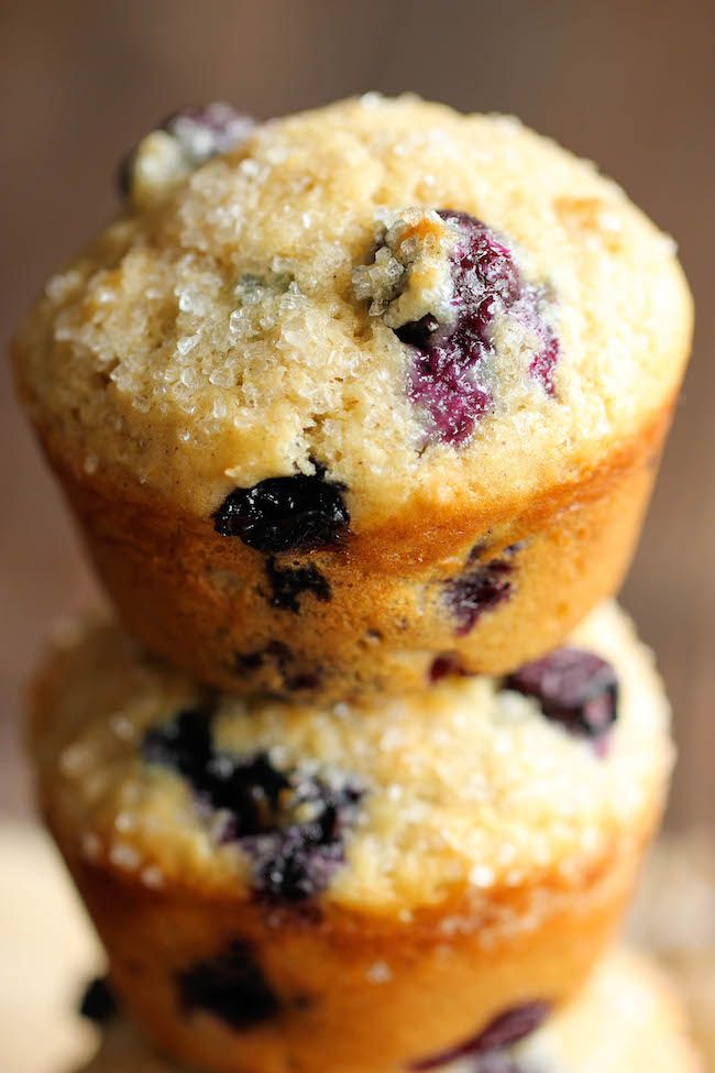 three blueberry muffins stacked on top of each other