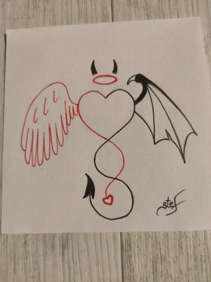 a drawing of a dragon with wings and a heart on it's back, sitting on top of a piece of paper