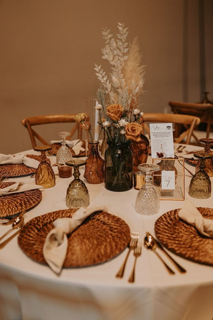 the table is set with place settings for dinner