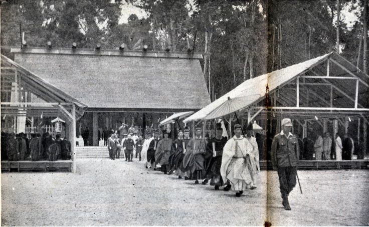 an old black and white photo of people walking in line