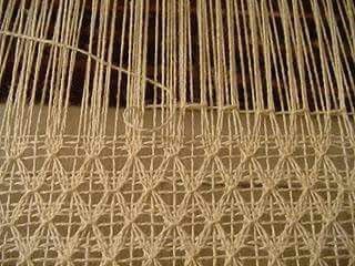 an image of some kind of weaving on a piece of cloth that is being woven