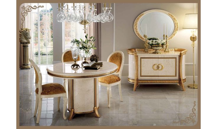 an elegant dining room with gold and white furniture