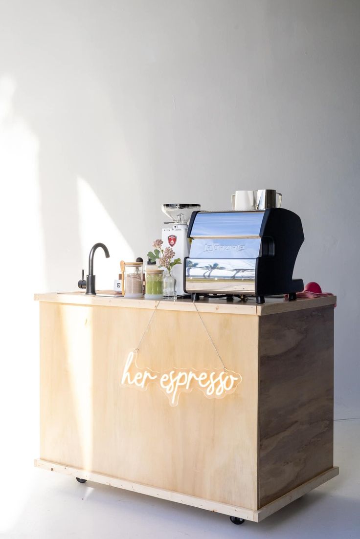 a wooden counter topped with an ice cream machine