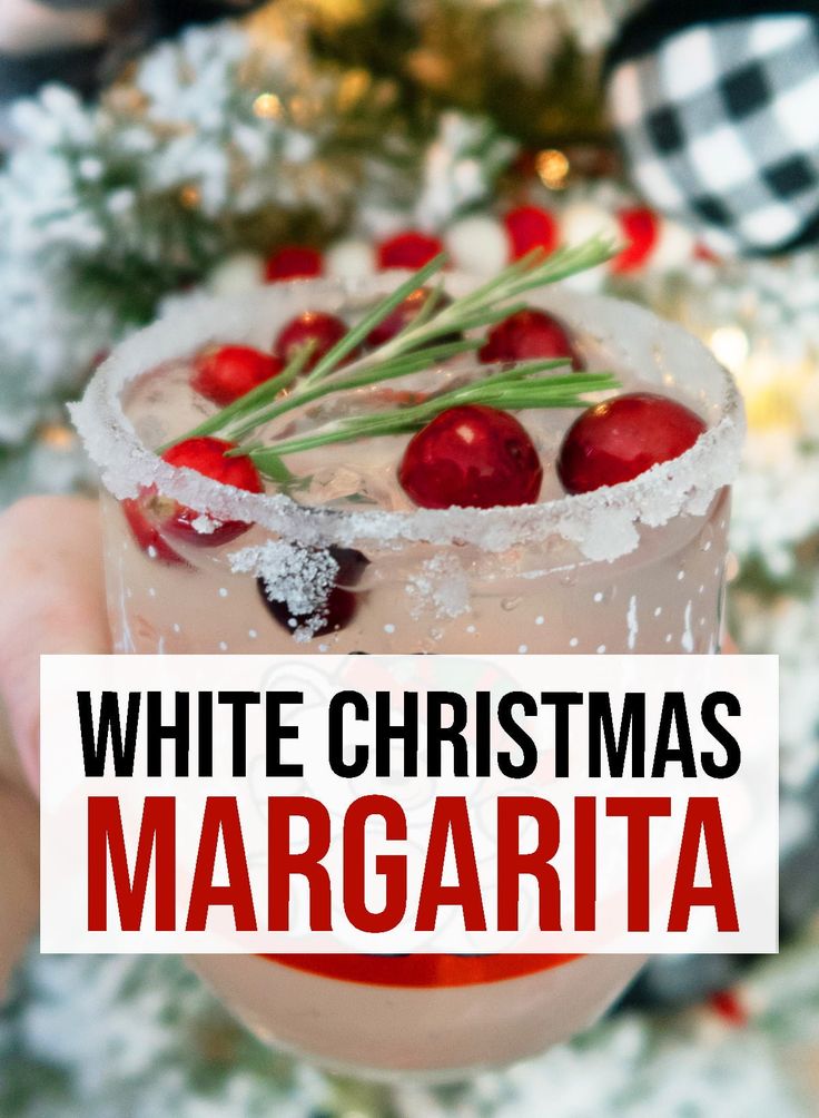 white christmas margarita with cranberries and rosemary garnish