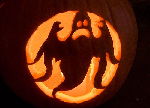 a carved pumpkin with a ghost on it