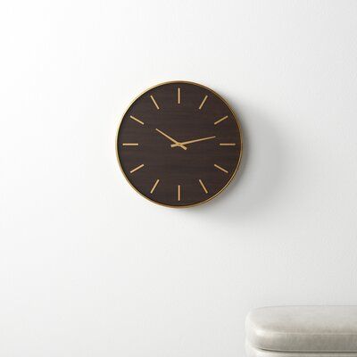 a wooden clock on the wall above a chair