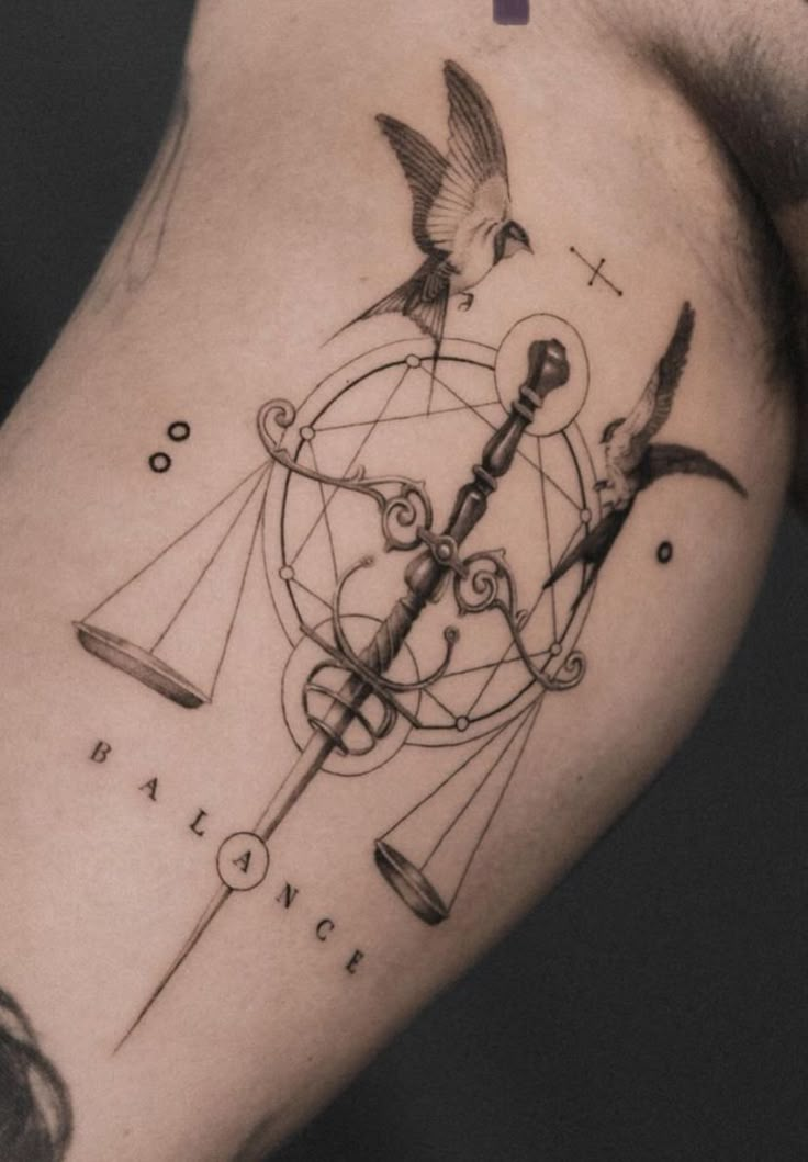 a man's arm with a tattoo on it that has birds flying around the clock