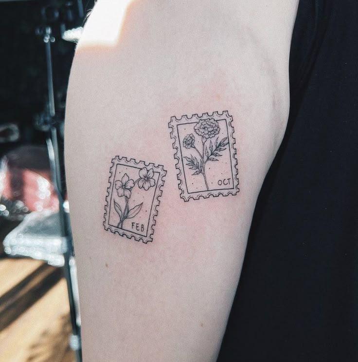 a woman's arm with two postage stamps and flowers on the left side of her arm