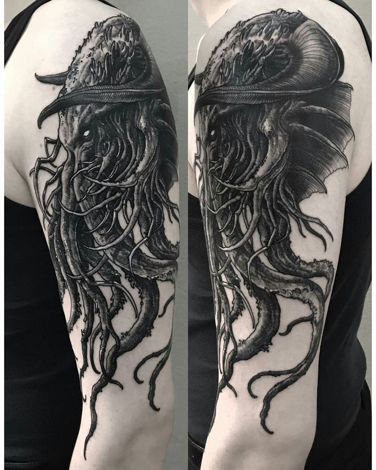 an octopus with a hat on its head tattoo by the artist in black and white