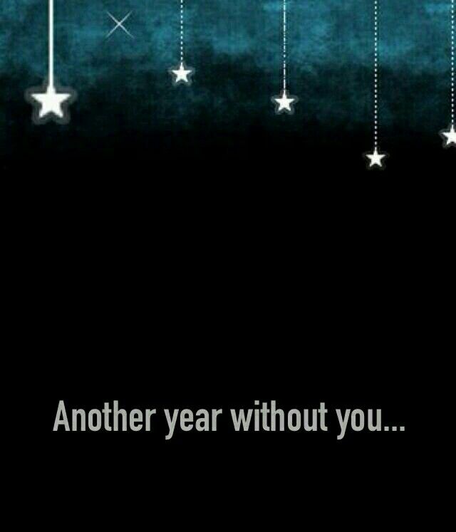 a black and white photo with stars hanging from it's sides, saying another year without you