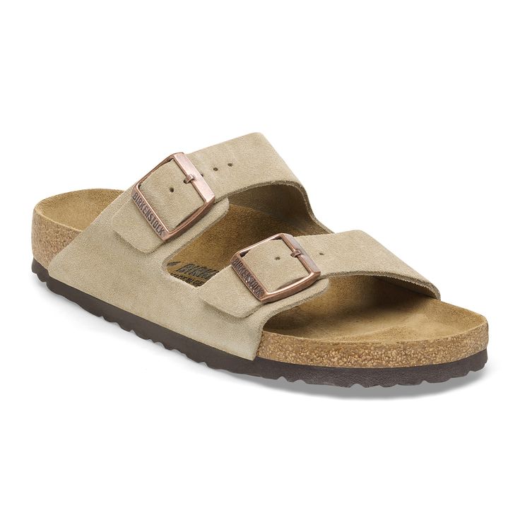 An icon of timeless design and legendary comfort the Arizona sandal has been defining style since 1973. Classic velvety suede gives the laid-back look that every season any style appeal. Complete with legendary BIRKENSTOCK design elements like a contoured cork-latex footbed for the ultimate in support. Contoured cork-latex footbed creates custom support with wear Classic suede upper Suede footbed lining helps keep you comfortable EVA sole is flexible and lightweight Two adjustable straps with me Classic Suede Slides With Removable Insole, Classic Suede Sandals With Leather Footbed, Classic Suede Sandals, Classic Suede Footbed Sandals With Removable Insole, Classic Suede Sandals With Textured Footbed, Classic Suede Sandals With Cushioned Footbed, Classic Suede Footbed Sandals With Round Toe, Classic Brown Sandals With Suede Lining, Classic Open Toe Sandals With Suede Lining