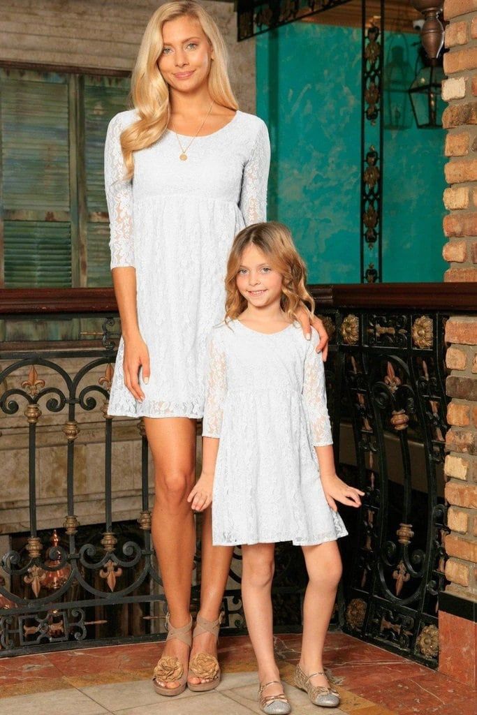 Easter Mommy And Me Dress White, Baptism Lace Dress, Matching Mom And Daughter Dress Matching mommy and me dresses. Empire waist short lace dresses in white. Designed and sewn by hand in Miami, FL Fully lined True to size High-quality stretchy lace Mother-daughter twinning look Empire waist Three-quarter sleeves Pullover style Adult Length: about 34.5" from shoulder to hem Plus sizes available Kids Length: from shoulder to hem by size (approx.): 18 mos - 2 years = 17"; 3 - 4 years = 20.5"; 5 - 6 White Lace Dress For Spring Baptism, White Lace Dress For Baptism In Spring, White Long Sleeve Dress For Holiday, White Long Sleeve Baptism Dress For Spring, White Spring Holiday Dress, White Long Sleeve Baptism Dress, Short Lace Dresses, Mom And Daughter Dress, Mommy And Me Dress