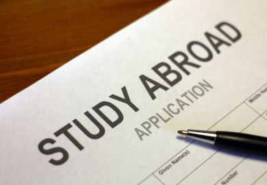 a study abroad application with a pen on it