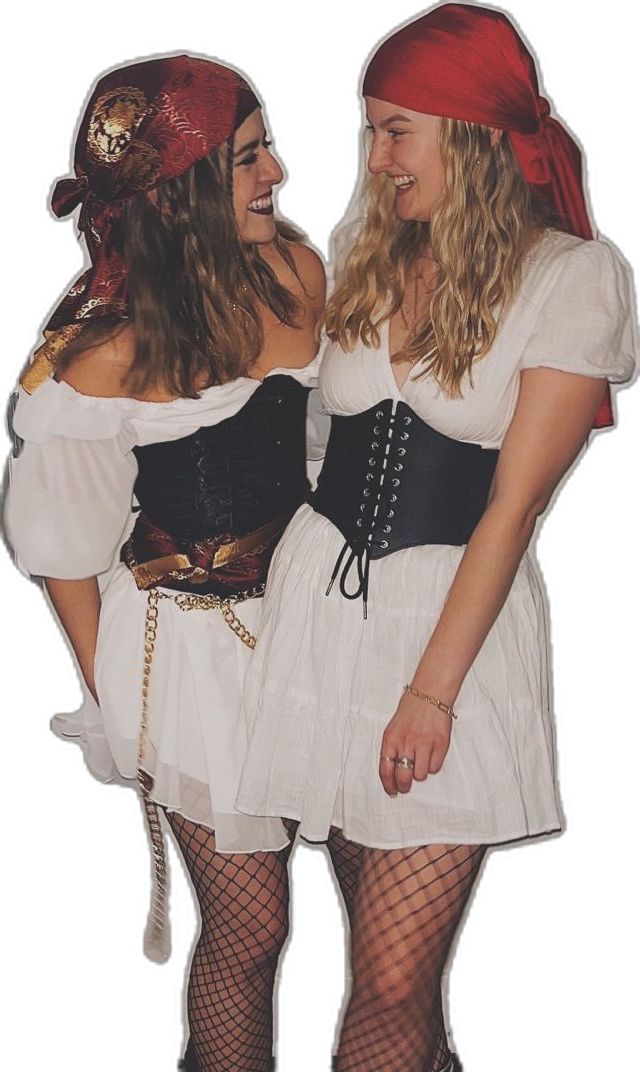 two women dressed in pirate costumes standing next to each other