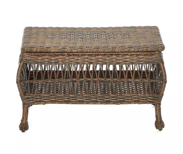 a wicker bench with wheels on the bottom and footrests, sitting against a white background