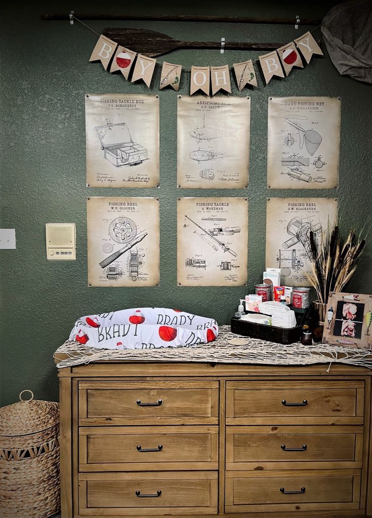 a baby's crib is shown with pictures on the wall and in front of it